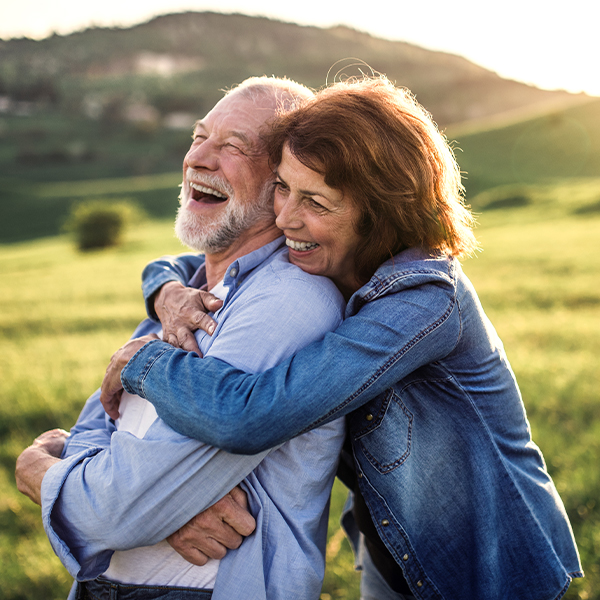 hugging senior couple outdoors annuity for retirement louisville ky evansville il american principal